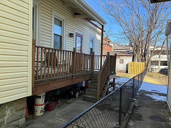 Side porch and fenced-in yard