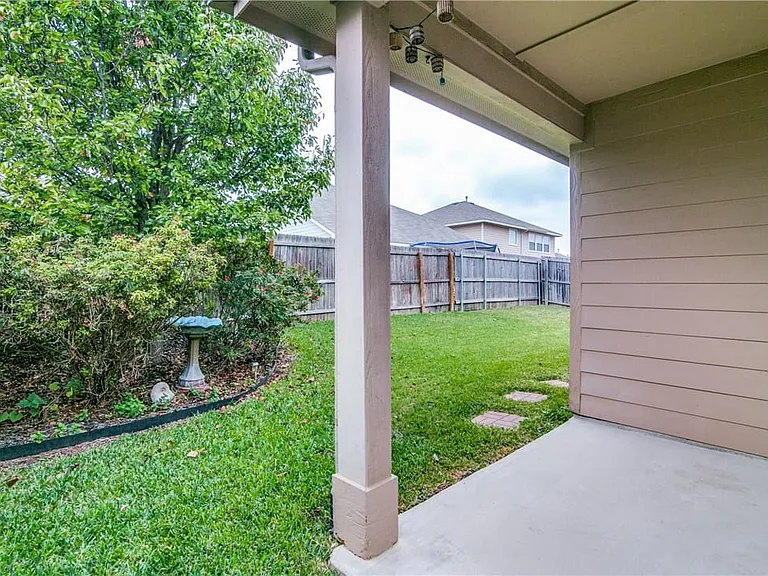 backyard has covered porch.