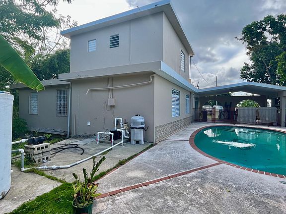 Pool area and view to the back of the house