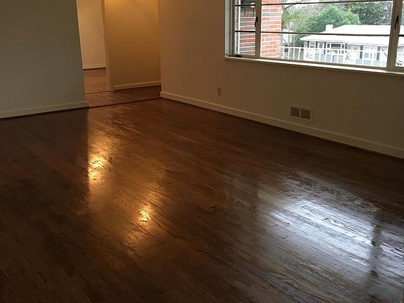View of Living Room from hallway looking to entry foyer which opens to den