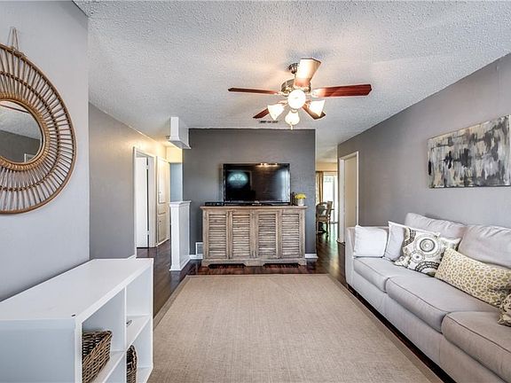 Living area leads to kitchen and bedrooms