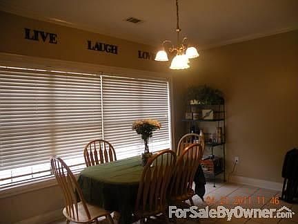 Kitchen with a beautiful, wide backyard view..