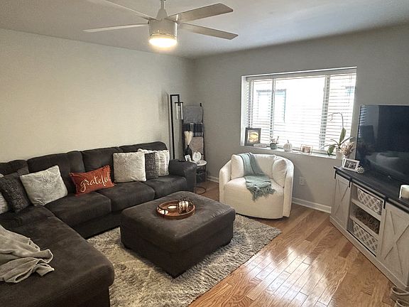 Living Area
Hardwood floors, sleek ceiling fan, sun-lite and spacious.
