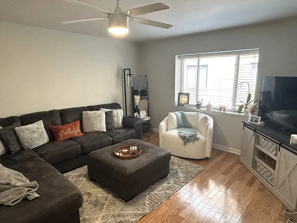 Living Area
Hardwood floors, sleek ceiling fan, sun-lite and spacious.