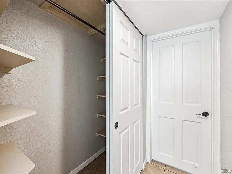 Hallway to backyard + large closet space