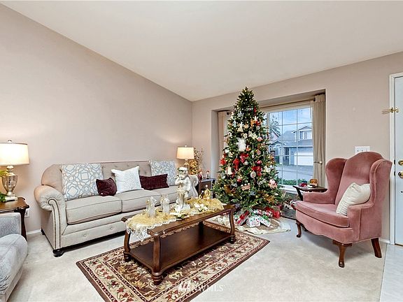 Formal living room has vaulted ceiling