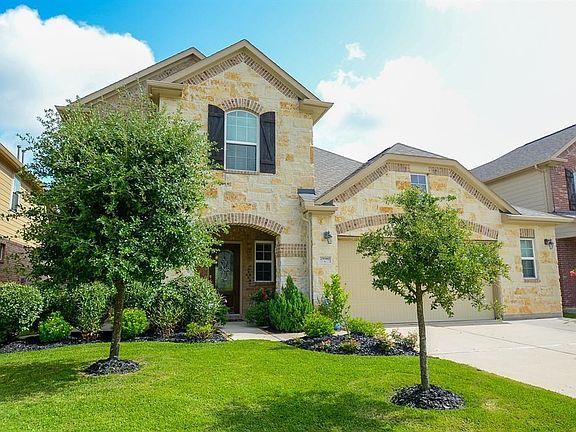 Another view of this beautiful home! There is a spacious two car drive way and beautiful landscaping!