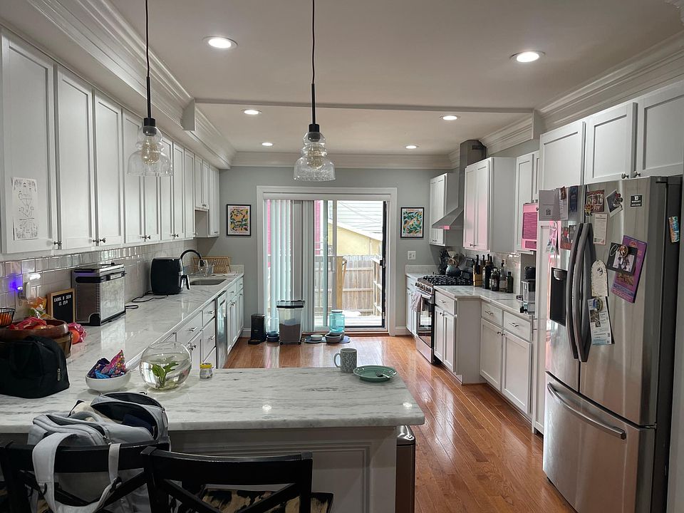 Huge (wide) kitchen, new appliances, tons of storage and counter space with private deck and patio off kichen in Back; new fence