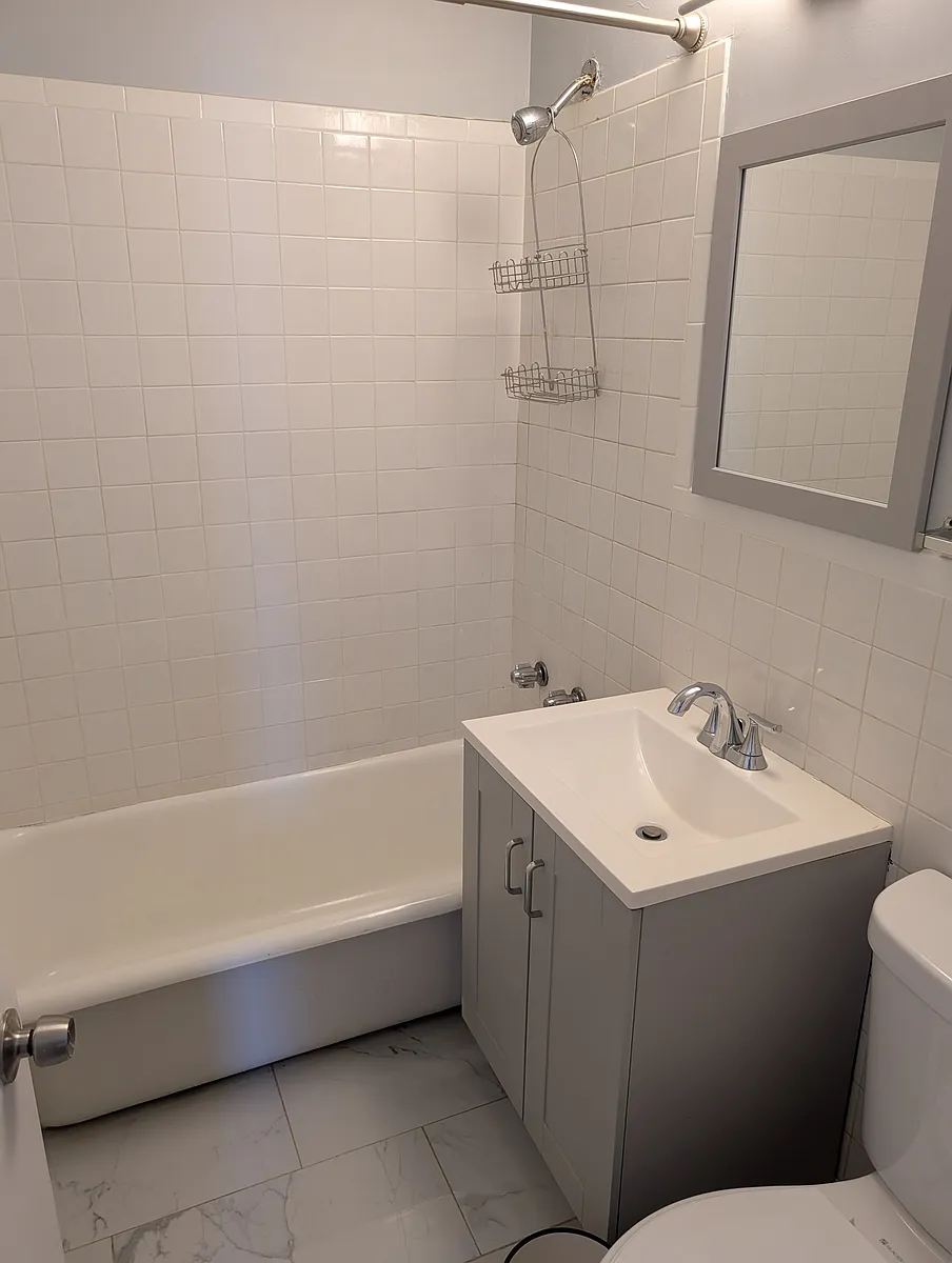 Building Photo - 7051 S Bennett Ave #204
