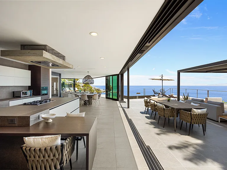 Enjoy meals in multiple dining areas, both indoor and outdoor, each offering breathtaking ocean views.
