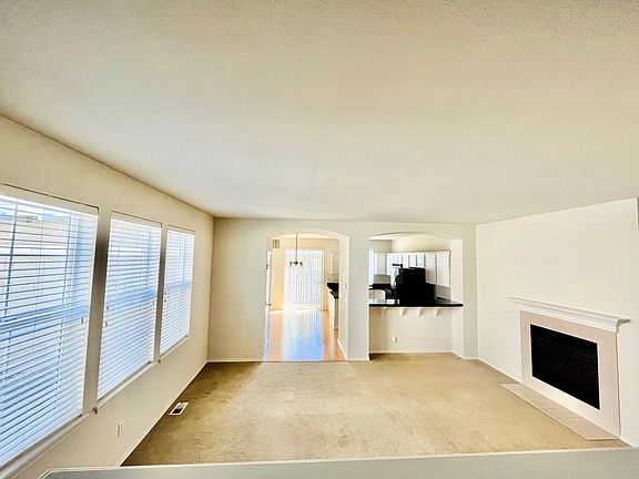 Giant well lit Great Room / Living Room with Gas Fireplace