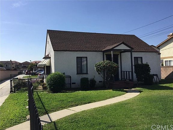 Notice the long driveway leading to 2 separate units, each with a two car garage and ample parking.