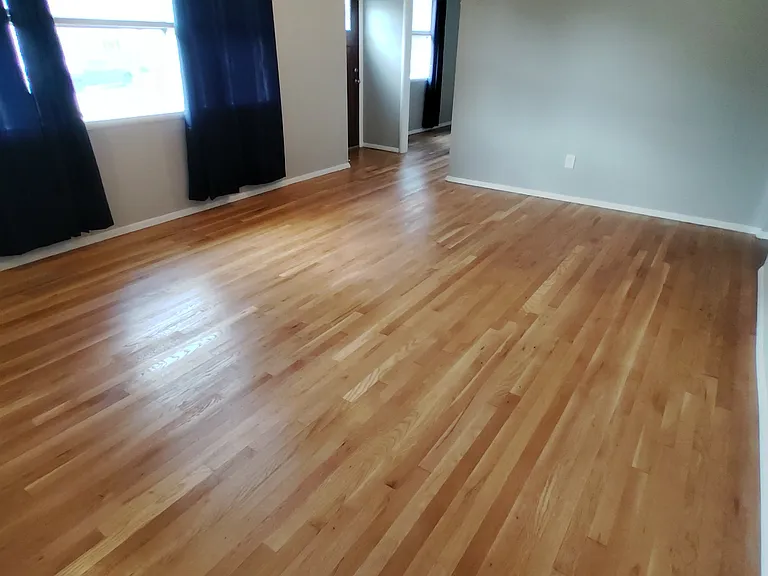Living Room with four dimmable recessed ceiling lights, and original, beautifully maintained hardwood floor.