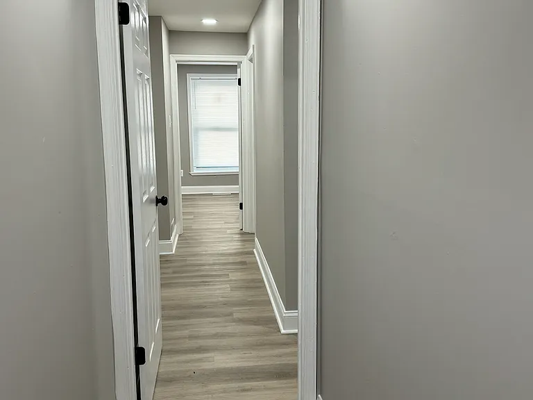 hallway to bedrooms and bathrooms off the main entrance.