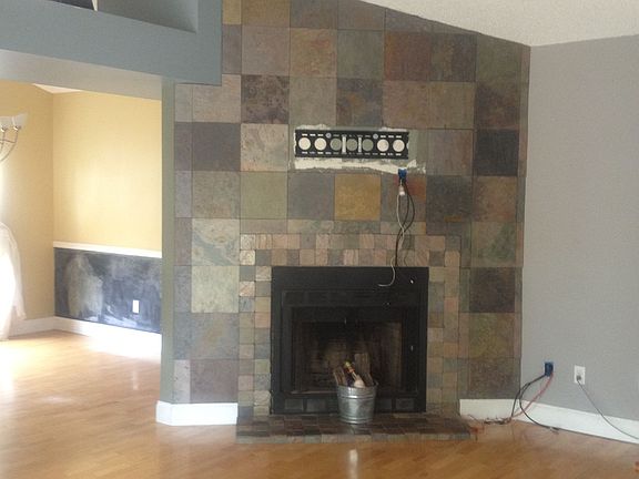 Great Room with slate fireplace with TV wall mount above it
