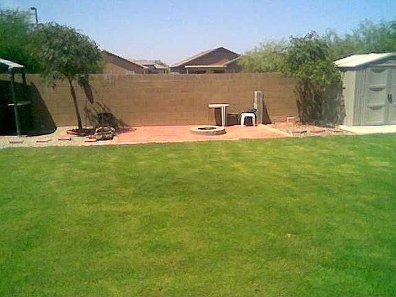 Plenty of grasssy area with Shaded BBQ w/Lights, Fire pit and Storgage Shed