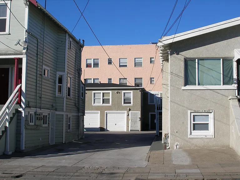 owner owns the building on the right and on the left. Unit for rent is in the middle.