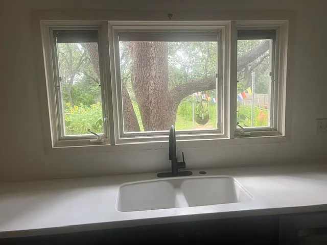 Back yard view with large Pella windows.