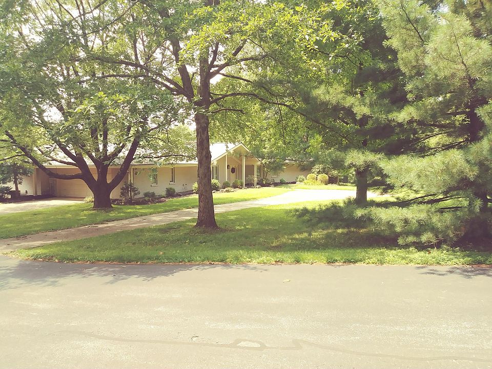 2.86 A Wooded 3943 SF Lawn Service Provided 3 Bedroom..3 Bath 12220 Browning Road in Boulder Pass Subdivision