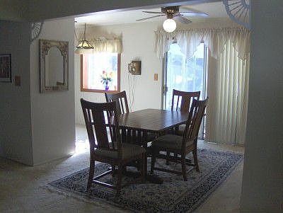 Dining area off kitchen with doorwall to Florida room.