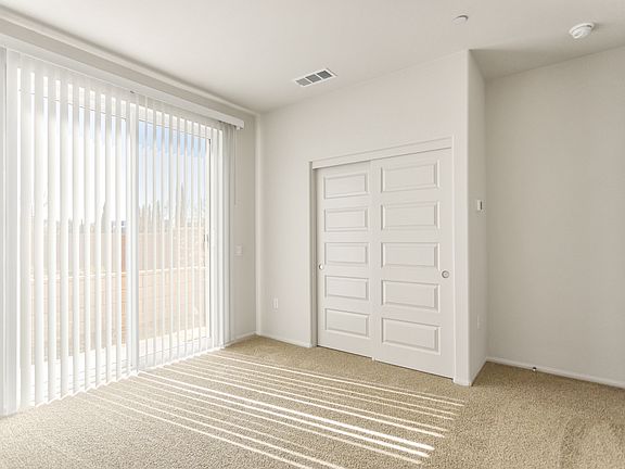 1st floor bedroom with access to small patio