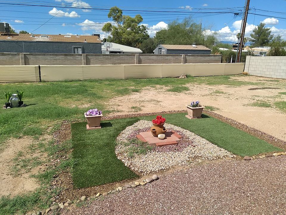 My backyard is large it is like peaceful area there is a wall on the right side of the yard and the rest of the yard as you can see if Vince is covered with cloth