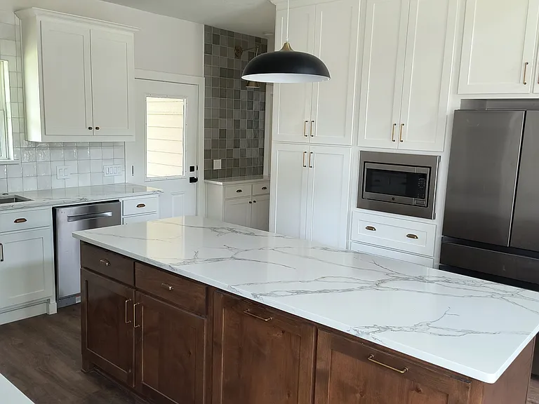 Wall of cabinets, stainless steal appliances,