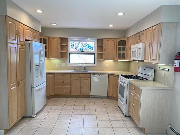 Updated Kitchen with a Refrigerator, Dishwasher, Gas Oven/Range & Overhead Microwave