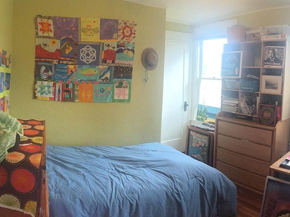 Downstairs bedroom, previously art studio, now repainted in a peaceful pale hue, tastefully furnished with brand new Seally mattress.