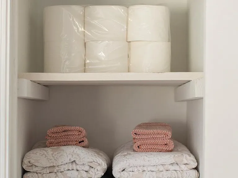 Small linen/utilty closet is across from bathroom.
