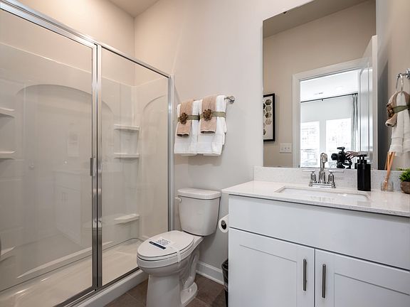 The main-floor bedroom offers it s own private bathroom, perfect for overnight guests.