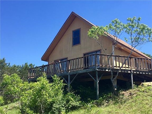 Front of the A-framed house towards the top of the hill.