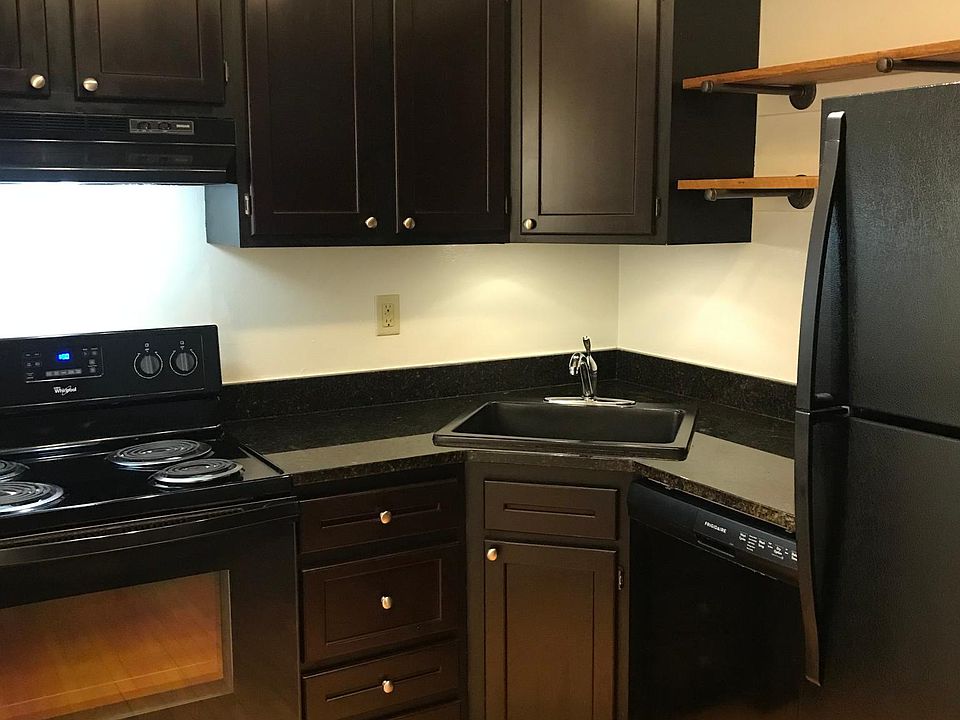 Kitchen with plenty of storage space. Full size fridge/freezer. Electric range.