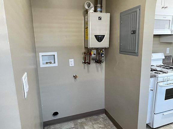 Tankless water heater. Washer/Dryer combo will be installed soon. Utility closet on the other side of the laundry room