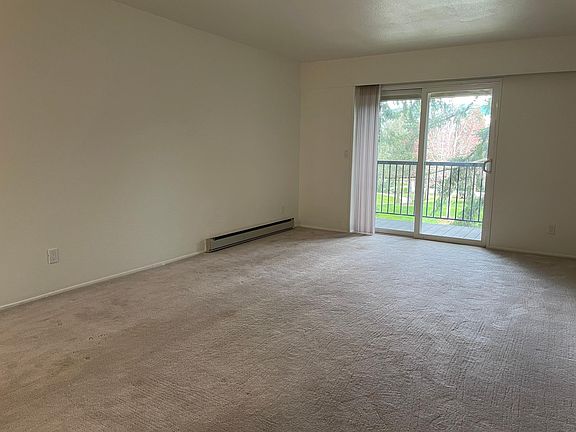 Large living room area runs about 12 ft by 20 ft! Big enough for couch and work area...Connected to dining area outside of kitchen. Top unit!