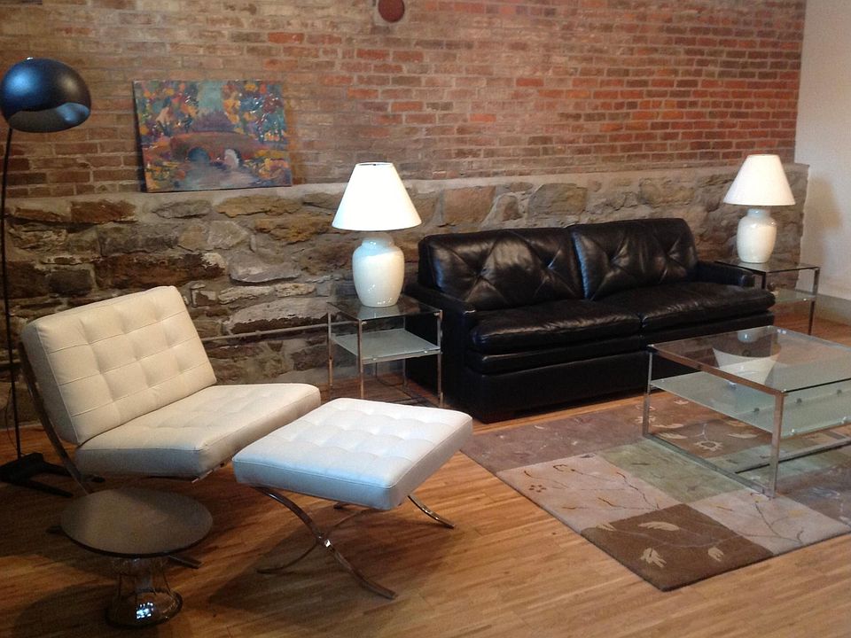 Living room. Exposed brick and stone. Leather furniture.