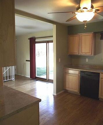 View from kitchen to dining and the walk-out to the patio areas