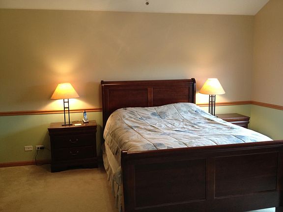 Master bedroom with barrel ceiling and ceiling fan