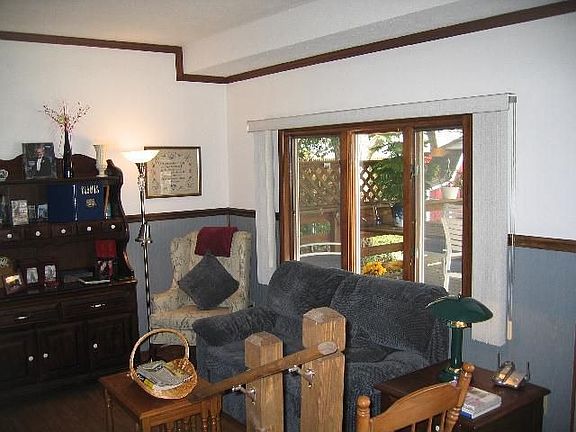 Den off kitchen w/wood stove