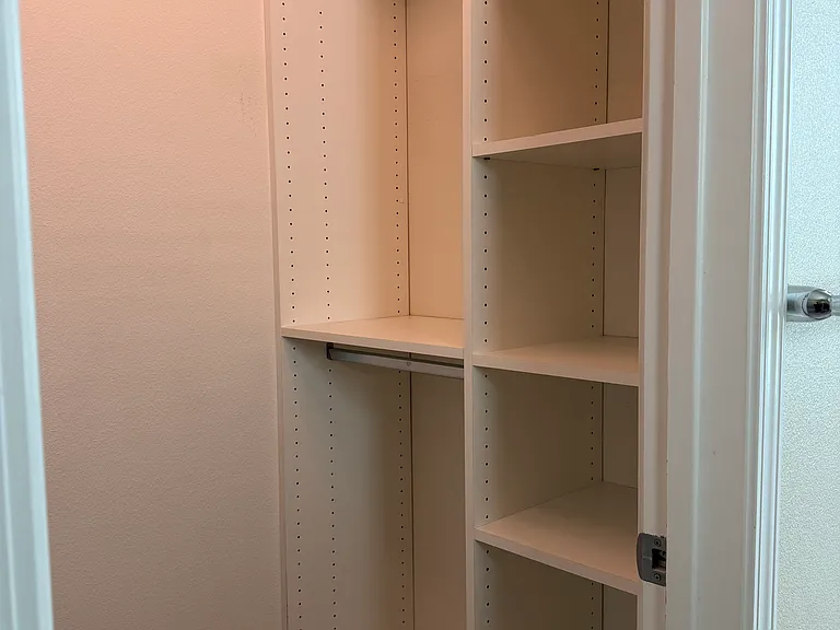 Finished walk-in closet attached to kids bedroom