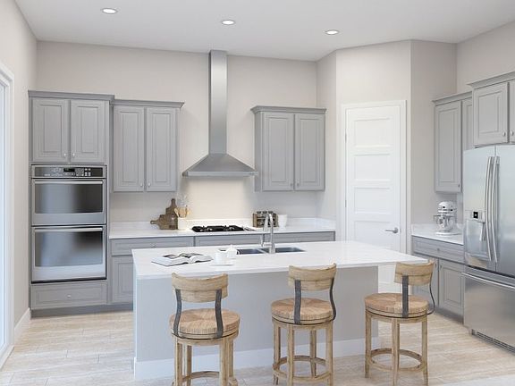 The center island offers extra counter space as well as a great place for self-serve style meals in