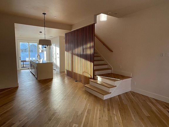 Beautiful kitchen with GE appliances, half bath, and living room on 2nd floor, separated from 3rd floor bedrooms.