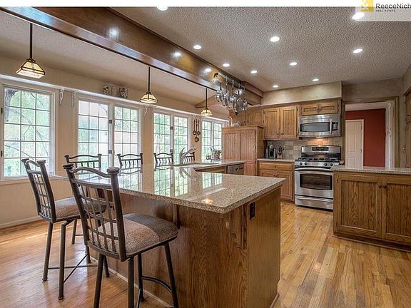 Wall of windows with wonderful natural light and amazing views of lush backyard.