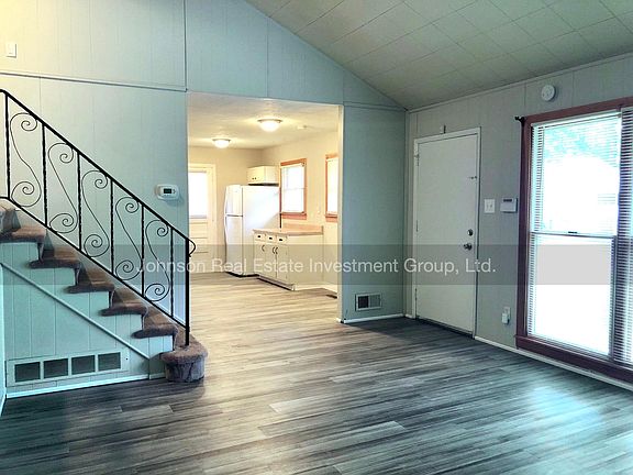 Open concept floor plan with kitchen open to living room.