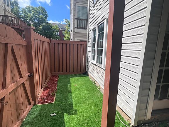 Low maintenance back yard with artificial turf