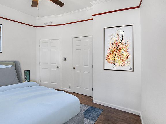 3rd bedroom with closet, new hardwood floors and paint