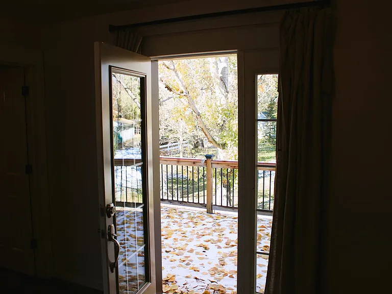 French Door in bedroom leading to outside deck.