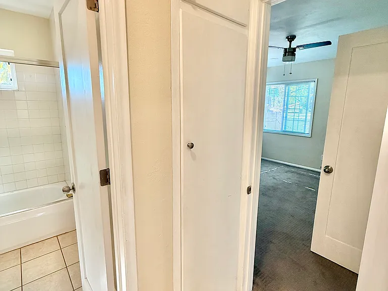 Hallway utility cabinet for extra storage.