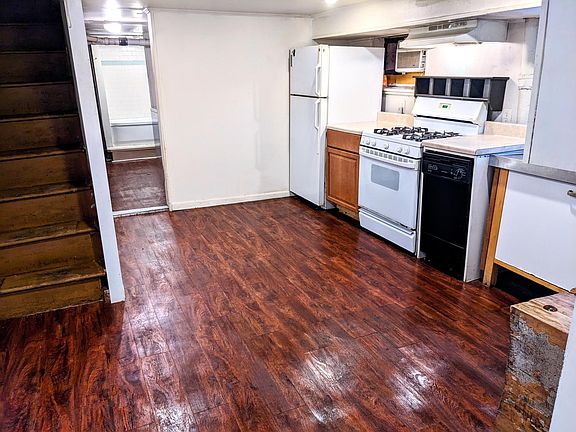 The steps on the right side are blocked off at the top and do not access the upstairs apt.