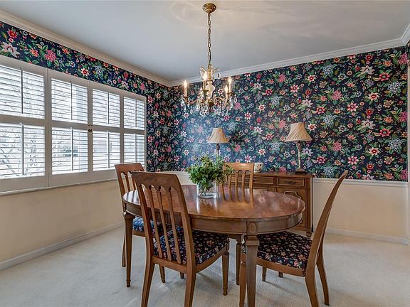 Dining room also has plantation shutters and access to the kitchen for ease of serving